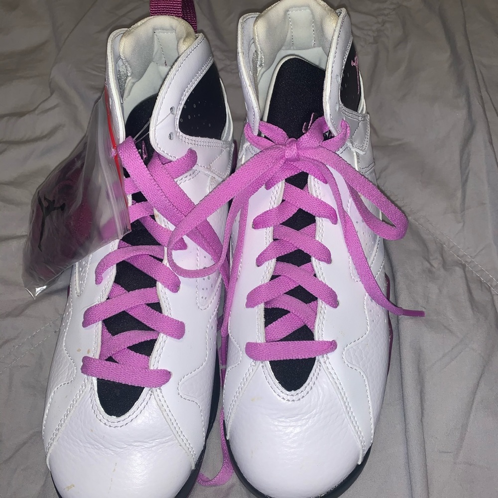 White and purple Air Jordan’s